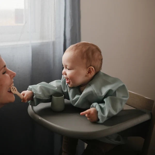 Mushie - Long Sleeve Bib in Dinosaurs