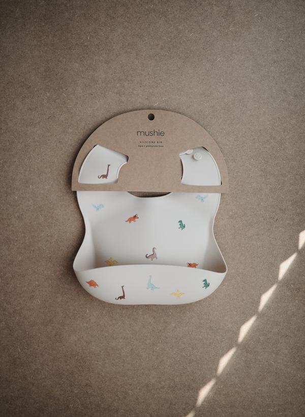 Mushie - Silicone Baby Bib in Dinosaurs