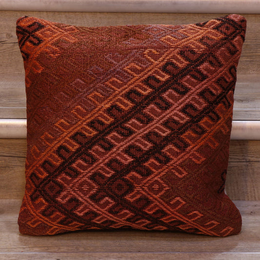 Geometric bands of decoration. Dusky pinky/red background.  Decoration in orange, black, pink and violet.